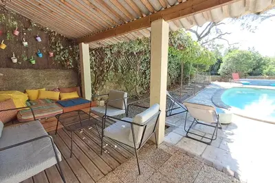 a patio with chairs and a swimming pool at Cigale piscine et jardin sans vis à vis in Fontcouverte