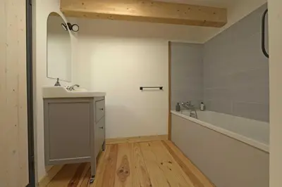 a bathroom with a sink and a bath tub at La maison du merle bleu in Quintillan