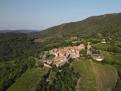 an aerial view of a village on a hill at La maison du merle bleu in Quintillan