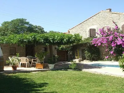 a house with a yard with a table and chairs at Holiday Home Charmante 3 Villa La Milouyette by Interhome in Peyriac-Minervois