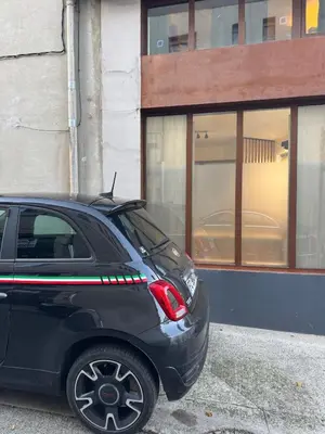a black car parked in front of a building at Un duplex pas comme les autres in Carcassonne