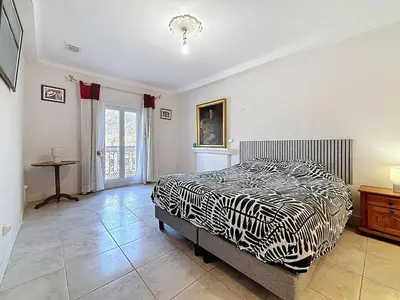 a bedroom with a zebra print bed and a table at Le Mirabeau - Appartement bourgeois - Terrasse 80m2 - Wifi et Climatisation in Narbonne