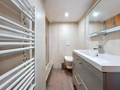 a bathroom with a sink and a toilet at Le Mirabeau - Appartement bourgeois - Terrasse 80m2 - Wifi et Climatisation in Narbonne