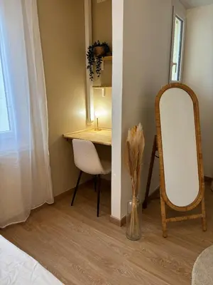 a dressing room with a mirror and a desk at Suite Bali et sauna privé - vidéo projecteur - escapade romantique-centre in Carcassonne