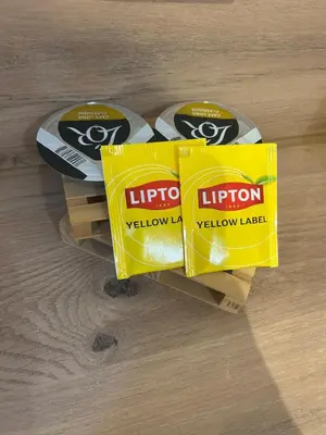 two boxes of lipton yellow pads on a wooden floor at Suite Bali et sauna privé - vidéo projecteur - escapade romantique-centre in Carcassonne