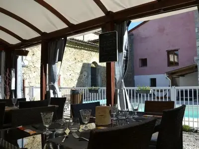 a bedroom with a large bed with a window at Camping 3 étoiles - Piscine - ccbecba in Roquefeuil