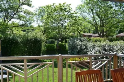 a living room with a couch and a table at Camping 3 étoiles - Piscine - ccbecba in Roquefeuil