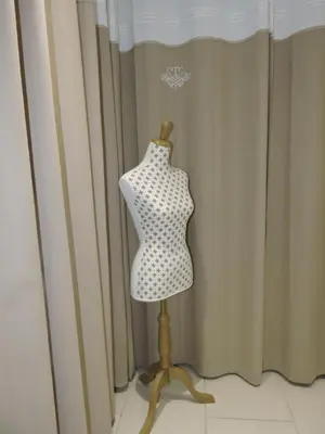 a mannequin on a stand in front of a curtain at Gîte Au Coeur Du Pays Cathare in Fanjeaux