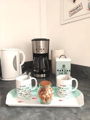 a tray with coffee cups and a blender on a counter at Lo Cabanot maison de pêcheur pour 4 in Port-la-Nouvelle