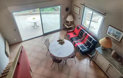 an overhead view of a living room with a table and chairs at Un Veritable Havre De Paix in Roquebrun
