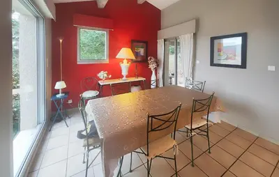 a dining room with a table and chairs at Un Veritable Havre De Paix in Roquebrun