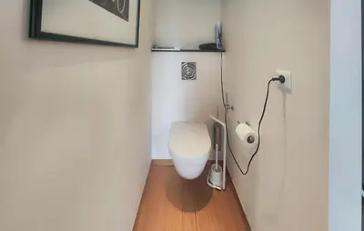 a bathroom with a white toilet in a room at Un Veritable Havre De Paix in Roquebrun