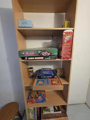 a book shelf filled with lots of food and snacks at Grande maison familiale, spacieuse et confortable in Espira-de-lʼAgly