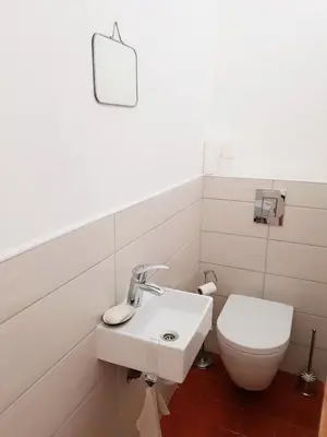 a bathroom with a sink and a toilet at La Sigeannaise belle maison près des plages in Sigean