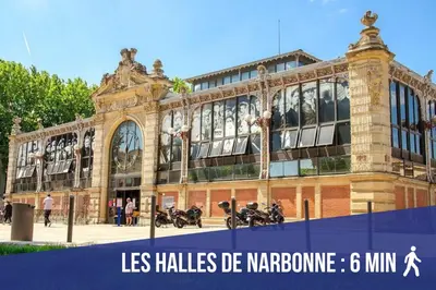 a large building with motorcycles parked in front of it at Studio Corneille -Climatisation WIFI Vue in Narbonne