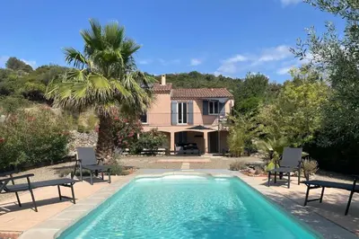 a villa with a swimming pool and a house at Les hauts d'Embres havre de paix pour 8 in Embres-et-Castelmaure