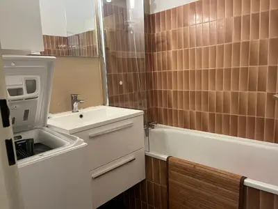 a small bathroom with a sink and a bath tub at Gruissan - T2 cosy 4 pers - Proche port - FR-1-796-95 in Gruissan