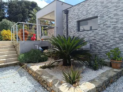 a brick house with plants in front of it at Studio terrasse au calme près de Narbonne in Montredon