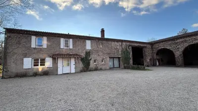 a large brick building with a driveway in front of it at Domaine de Hauterive in Pont-de-Larn
