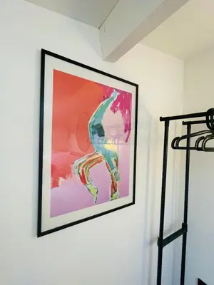 a painting hanging on a white wall at Maison Franz - 800m des Grands Buffets - Garage in Narbonne