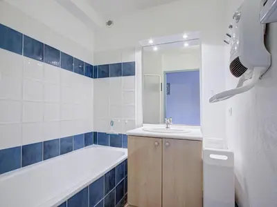 a bathroom with a tub and a sink and a bath tub at PMinervois I N02 Villa 3P6 in Homps