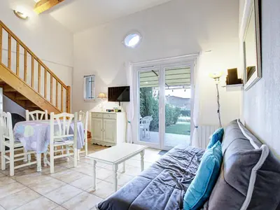 a living room with a couch and a table at PMinervois I N02 Villa 3P6 in Homps