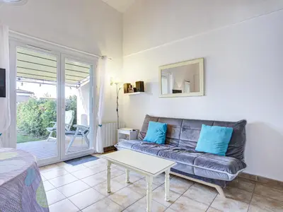 a living room with a couch and a table at PMinervois I N02 Villa 3P6 in Homps