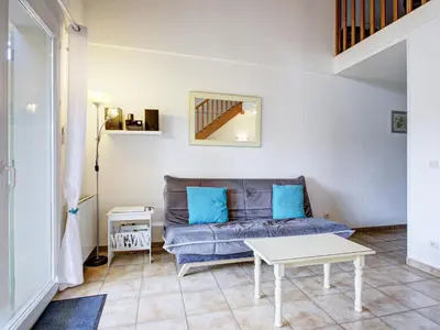 a living room with a couch and a table at PMinervois I N02 Villa 3P6 in Homps
