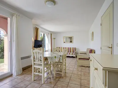a kitchen and living room with a table and chairs at P Minervois L N02 Villa 3P6 in Homps