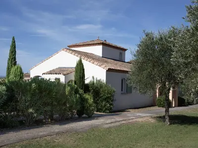 a white house with a roof at P Minervois S N06 Villa 4P8 in Homps