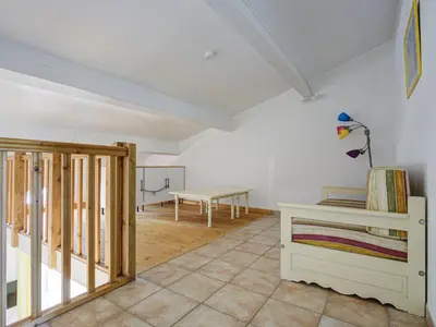 a room with a table and a bench in a room at P Minervois J N03 Villa 3P6 in Homps