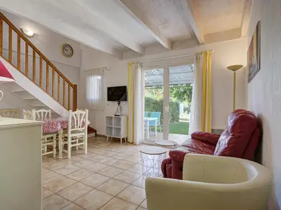 a living room with a couch and a table at P Minervois J N03 Villa 3P6 in Homps