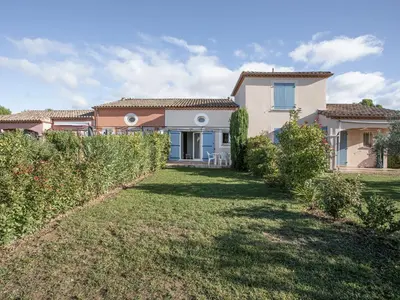 a house with a lawn in front of it at P Minervois C N02 Villa 3P6 in Homps