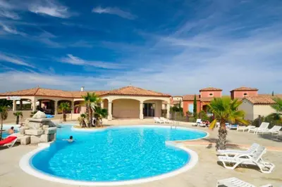 a swimming pool in front of a resort at P Minervois C N02 Villa 3P6 in Homps