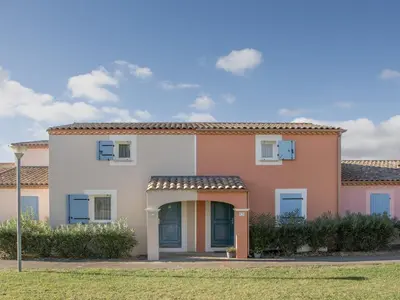 a large house with an orange and white at P Minervois C N02 Villa 3P6 in Homps