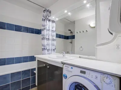 a bathroom with a washing machine and a sink at P Minervois U N04 VILLA 3P6 in Homps