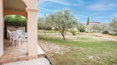 a living room with a couch and a table at P Minervois I N01 Villa 4P8 in Homps