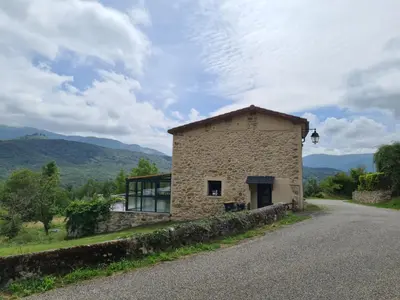 a stone house on the side of a road at Lagrange in Leychert