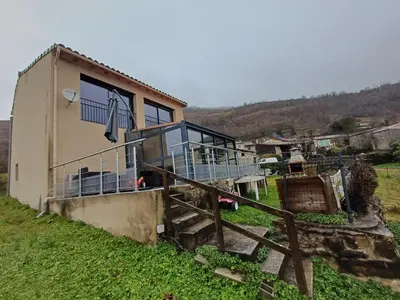 a house with a balcony on the side of it at Lagrange in Leychert