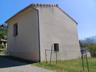 a large white building with a fence around it at Lagrange in Leychert