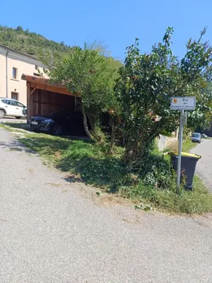 a garage with a car under it next to a street at Lagrange in Leychert