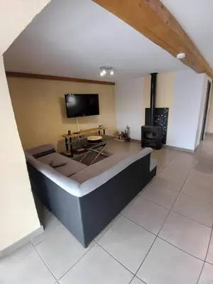 a large living room with a couch and a tv at Lagrange in Leychert