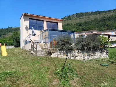 a house on a hill with a stone wall at Lagrange in Leychert