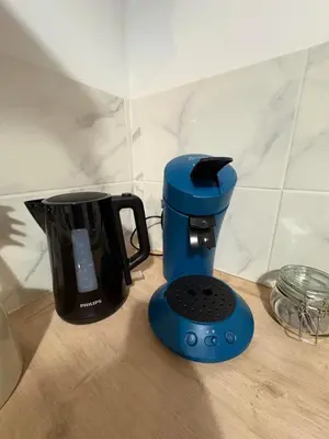 a blue blender sitting on top of a counter at La coloc' l 3 Chambres avec salle de bain & TV in Castres