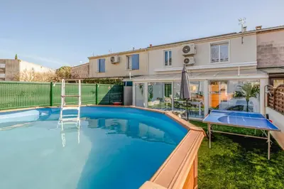 a swimming pool in the backyard of a house at La douce echappee in Trèbes
