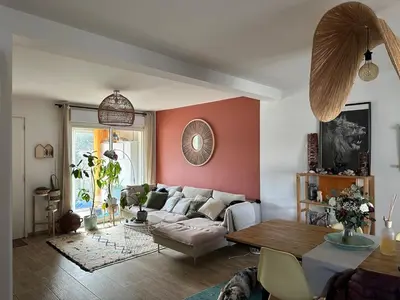 a living room with a couch and a table at Maison narbonne in Narbonne