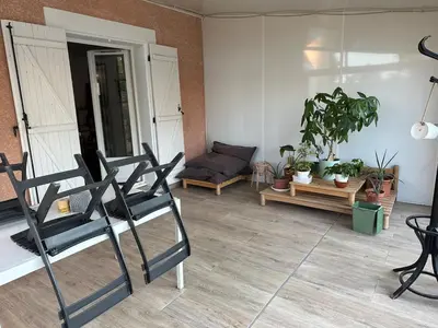 a living room with two chairs and a couch at Maison narbonne in Narbonne
