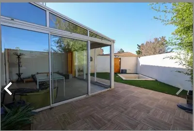 a glass extension of a house with a patio at Maison narbonne in Narbonne