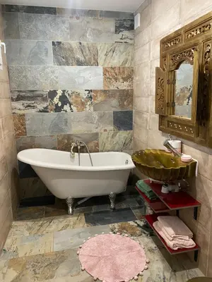 a bathroom with a tub and a sink at Studio climatisé avec terrasse in Narbonne