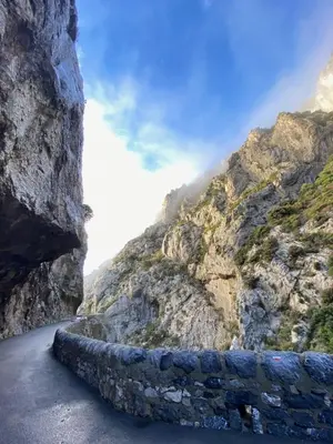 a mountain road with tires on the side at Gite La Grange, climatisée, vue sur le château de Peyrepertuse in Rouffiac-des-Corbières